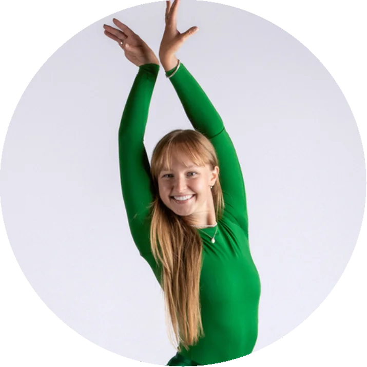 Dance Barre student performing with arms raised